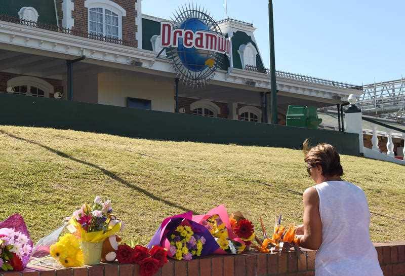 Flowers are laid outside the Dreamworld Theme Park on the Gold Coast