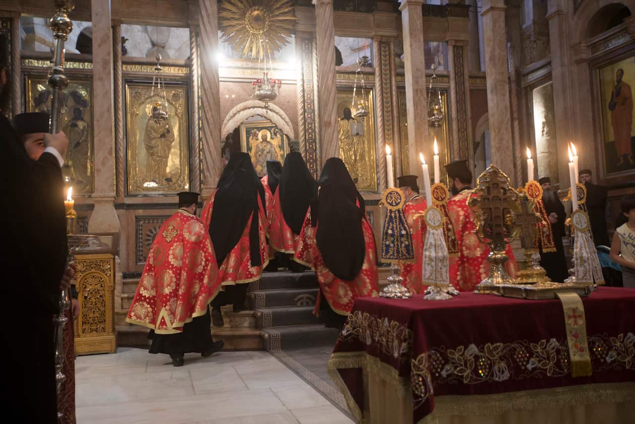 Greeks orthodox clergy during a Mass at the Church of the Holy Sepulchre, in the old city of Jerusalem, 28 October 2016. Archaeologist have for the first time in centuries exposed the original surface of what's believed to be the traditionally burial plac