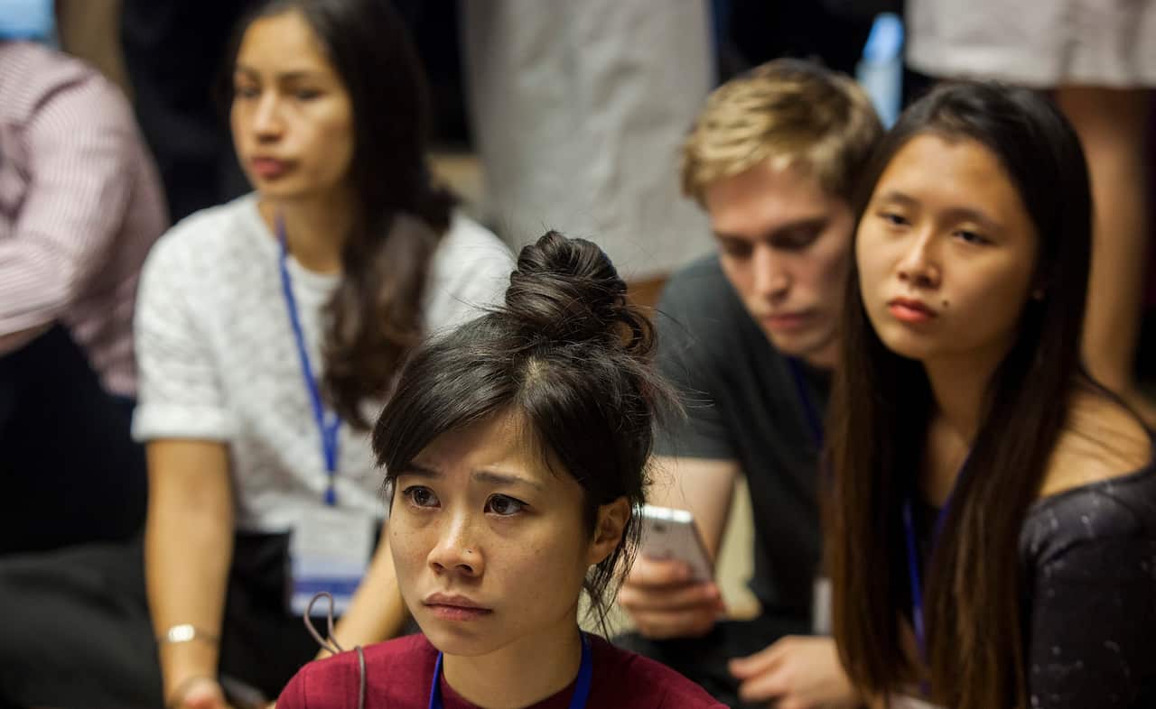 US Democratic Party supporters react to live coverage of the US elections at an event hosted by the American Chamber of Commerce (AmCham) in Hong Kong, China