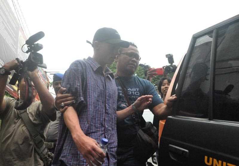 Australian teenager Jamie Murphy is escorted at Kuta police station, Bali, Indonesia, Tuesday, Nov. 22, 2016. 