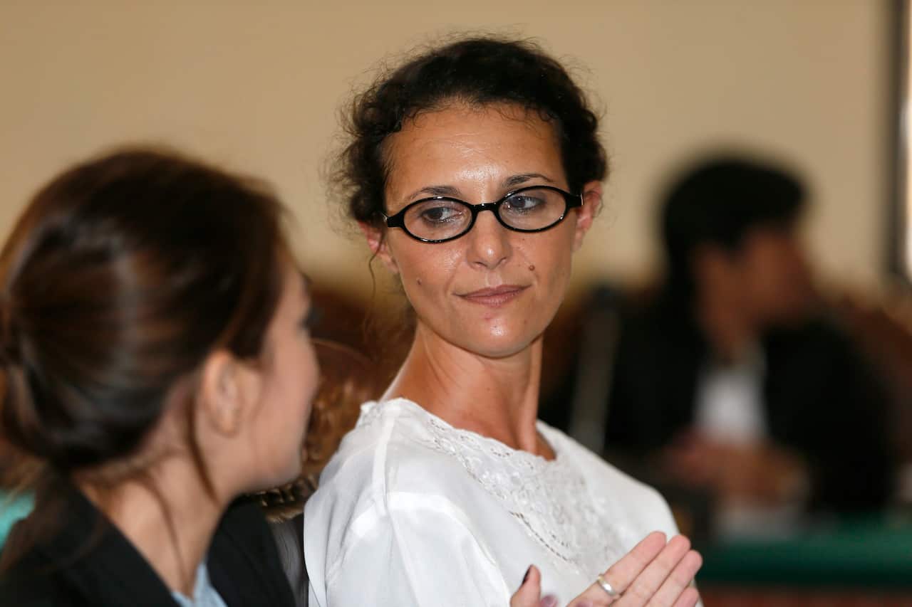 Australian Sara Connor listens to her interpreter during a trial at the Denpasar District Court in Bali, Indonesia, 24 November 2016.
