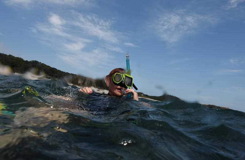 One Nation Senator Pauline Hanson snorkels on the Great Barrier Reef off Great Keppel Island.