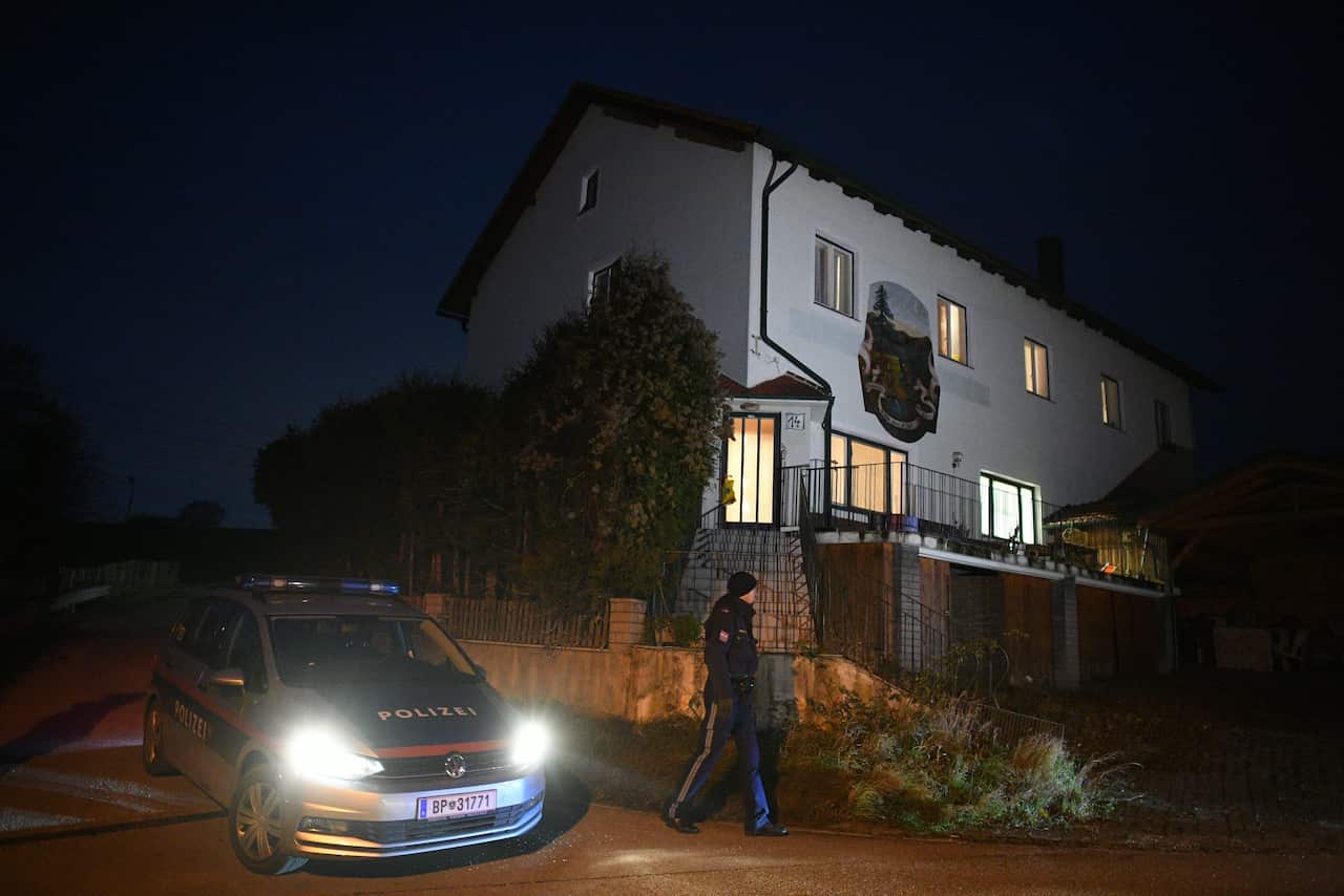 Austrian police stands outside a house near Boeheimkirchen, Lower Austria.