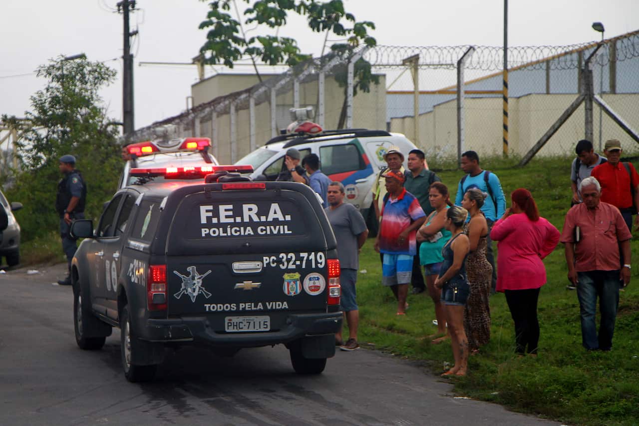 Relatives of prisoners wait for information outside the Anisio Jobim Penitentiary Complex in Manaus, Brazil