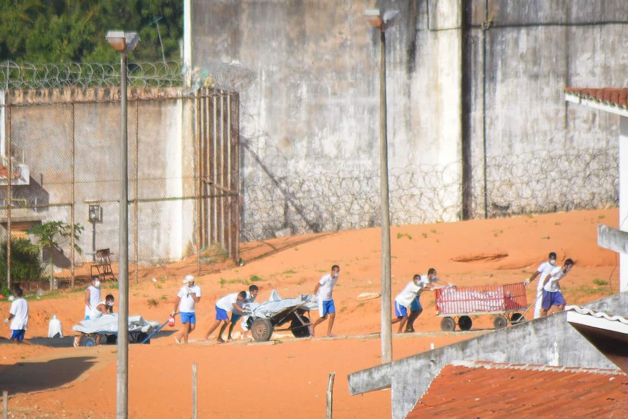 Bodies of inmates are taken out of the Alcauz prison in Natal, northeast of Brazil, on 15 January 2017, after a deadly riot.