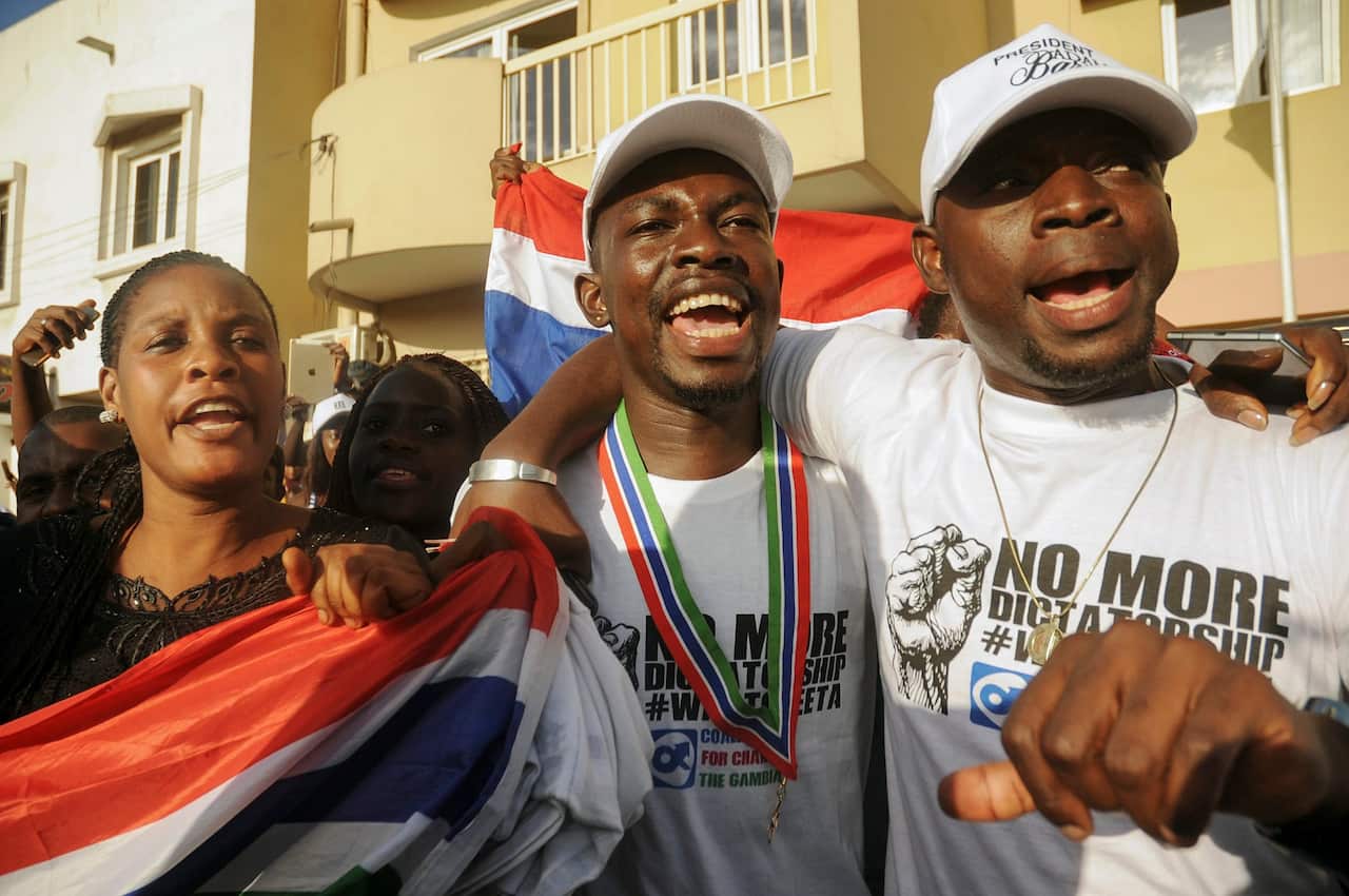 Supporters of President-elect of Gambia Adama Barrow cheer upon his arrival to be sworn in as president at the Gambia embassy in Dakar, Senegal, 19 January 2017
