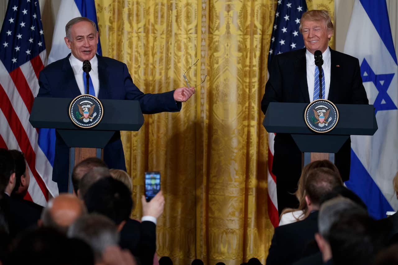 President Donald Trump listens as Israeli PM Benjamin Netanyahu speaks during their joint news conference in the East Room of the White House 2/15/2016.