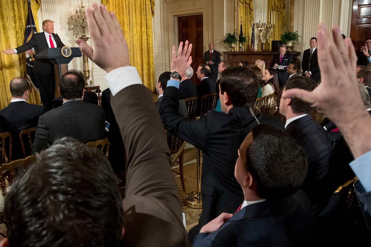 Reporters raise their hands for questions as President Donald Trump speaks during a news conference, Thursday, Feb. 16, 2017, in the East Room of the White House in Washington. (AP Photo/Andrew Harnik)