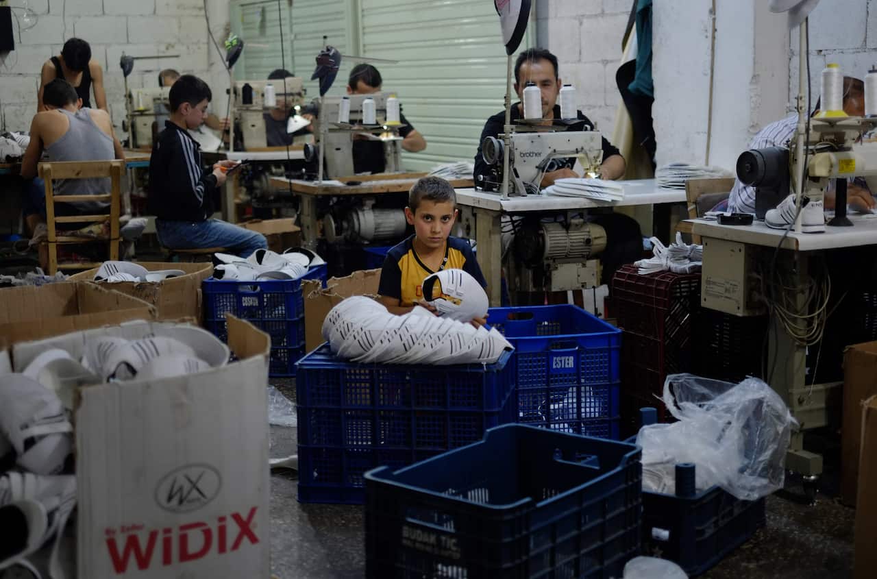 FILE: A Syrian refugee child works at a shoe workshop in Gaziantep, southeastern Turkey.