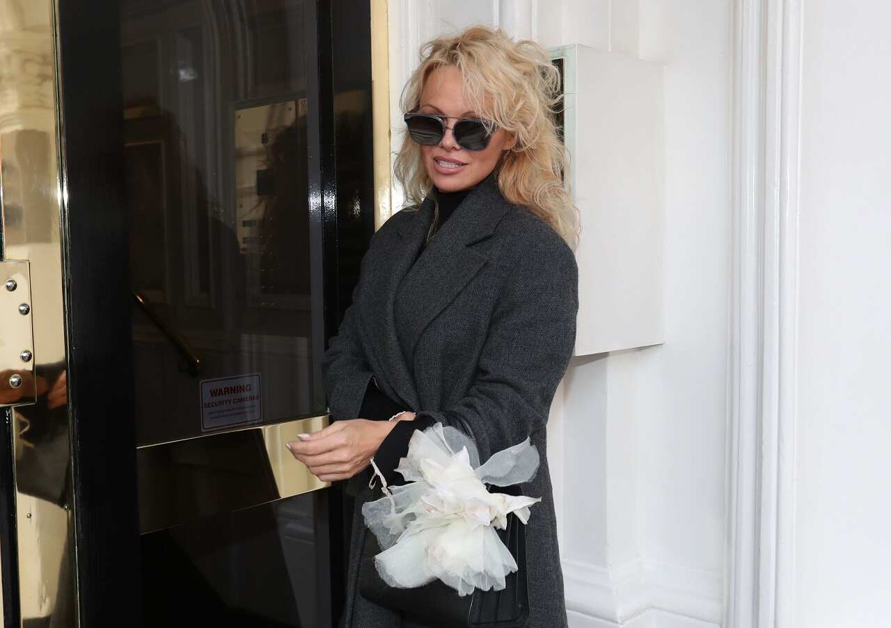 Pamela Anderson arrives to visit Julian Assange at the Ecuadorian embassy in London.