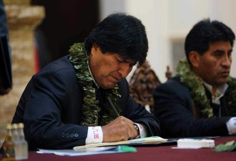 President of Bolivia, Evo Morales, signs a new coco law advancing a progressive drug policy in La Paz, Bolivia
