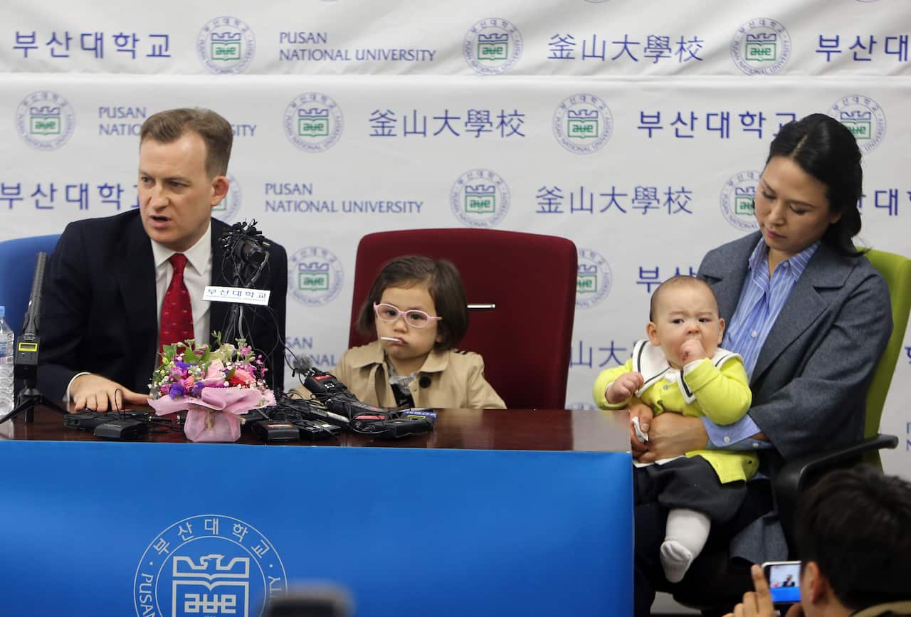 Robert Kelly (L), with his wife Kim Jung-a (R), 4-year-old daughter Marion and 8-month-old James holds a press conference in Busan, South Korea, 15 March 2017.