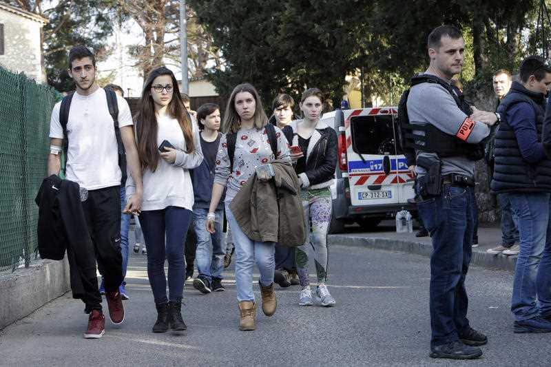 Children leave their high school after an attack in a high school in Grasse, southern France, Thursday, March 16, 2017. 