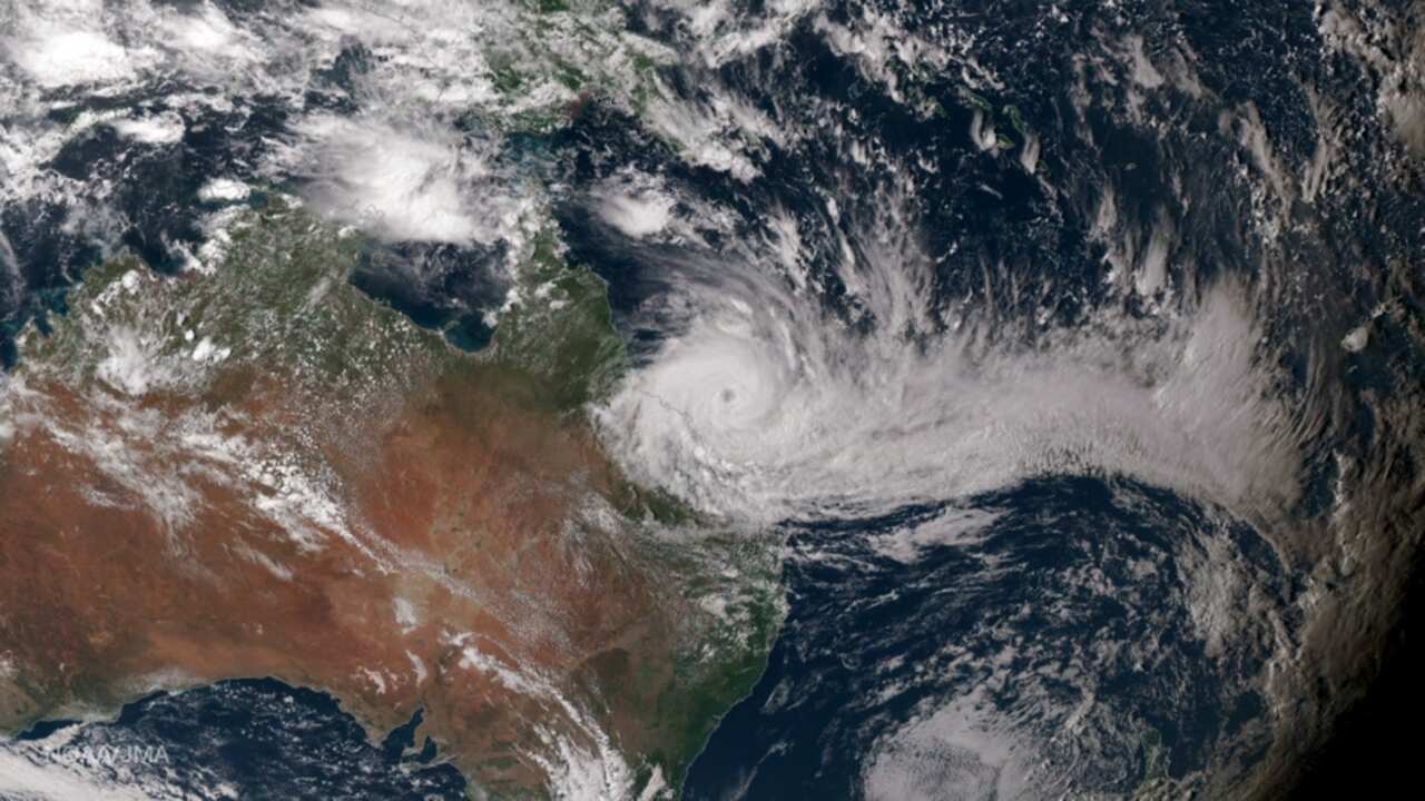 A  photo by NOAA showing Japan Meteorological Agency's true-color image of Tropical Cyclone Debbie at  0510 UTCon 27 March 2017.   