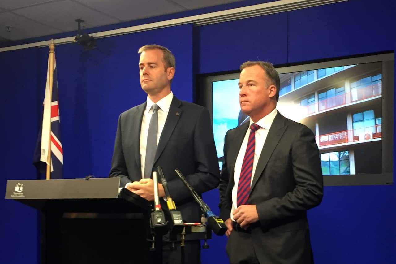 Michael Ferguson (left) has pulled out of the contest to replace outgoing Premier Will Hodgman. 