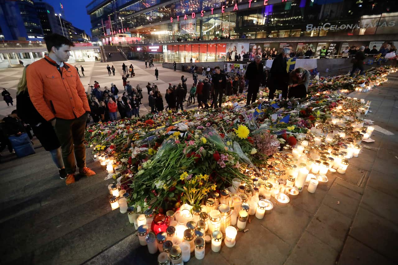 Candles and flowers placed at the Sergels Torg to commemorate the victims of last Friday's terror attack in Stockholm, Sweden, Sunday, April 9, 2017.