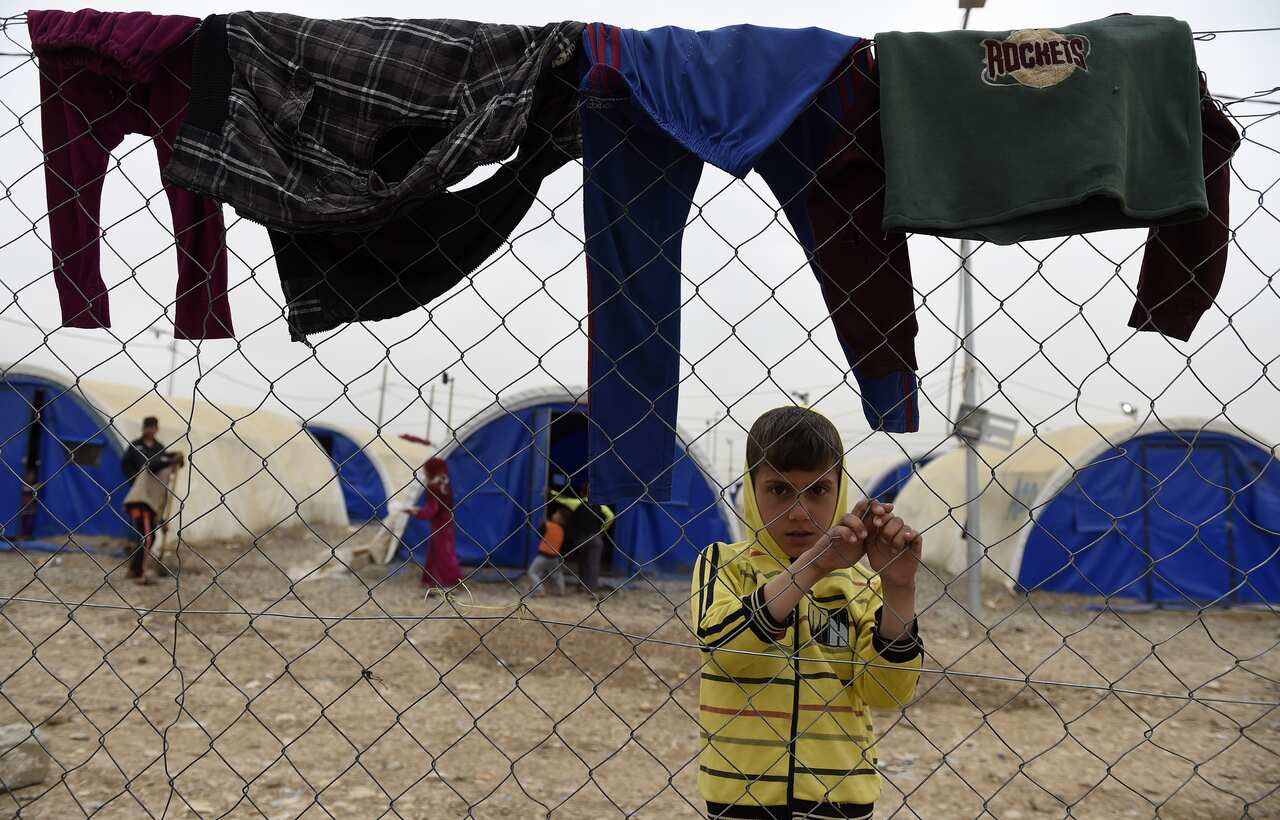 Iraqi refugees seen at Hammam Aleel refugee camp just outside Mosul city in April 2017.