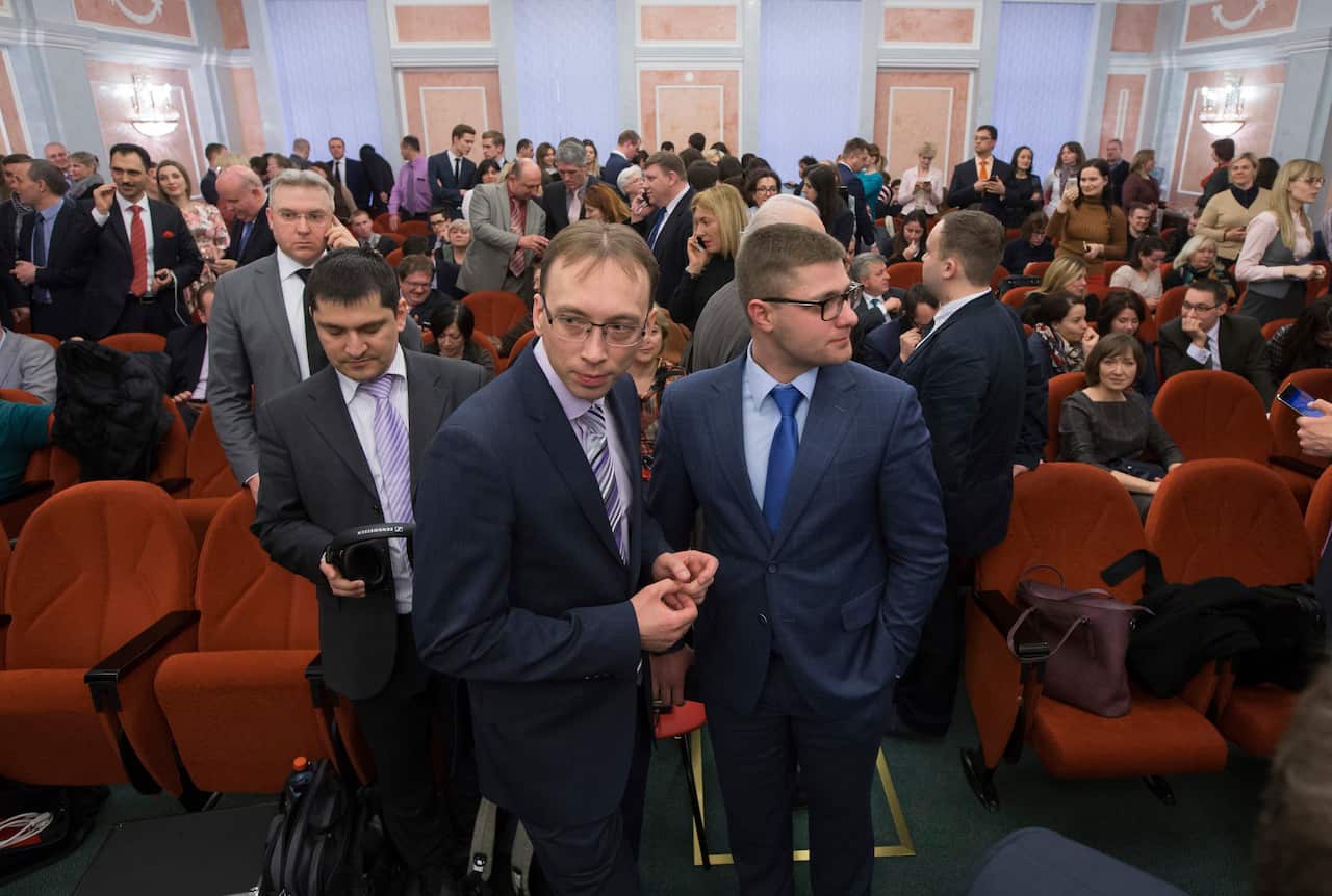 Members of the Jehovah's Witnesses wait for the decision in court in Moscow.