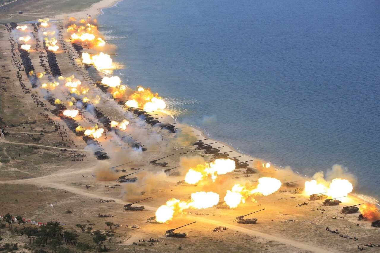 An undated photograph released by the Korean Central News Agency (KCNA) on 26 April 2017 shows a combined fire demonstration of North Korean artillery. 