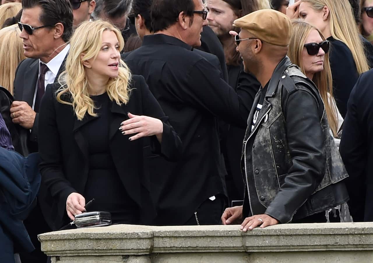 Musicians Courtney Love and Tom Morello attend the funeral.