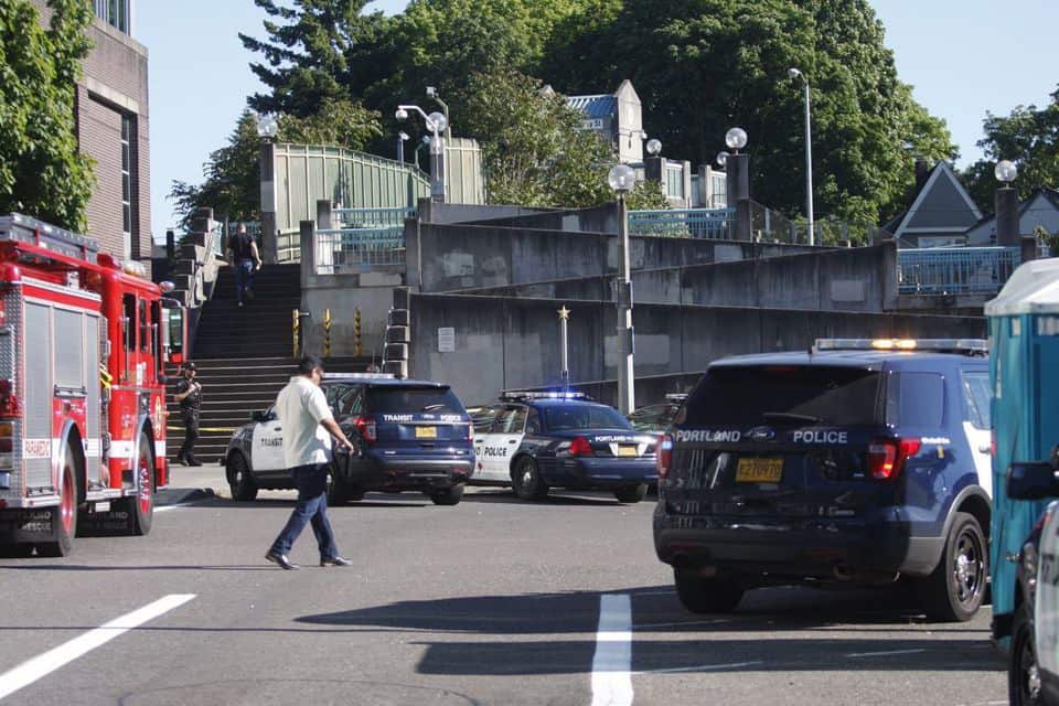 Police on the scene at a MAX train station in Northeast Portland