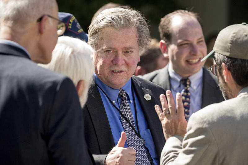President Donald Trump's White House Senior Adviser Steve Bannon gives a thumbs up as he talks with staffers following President Donald Trump's speech