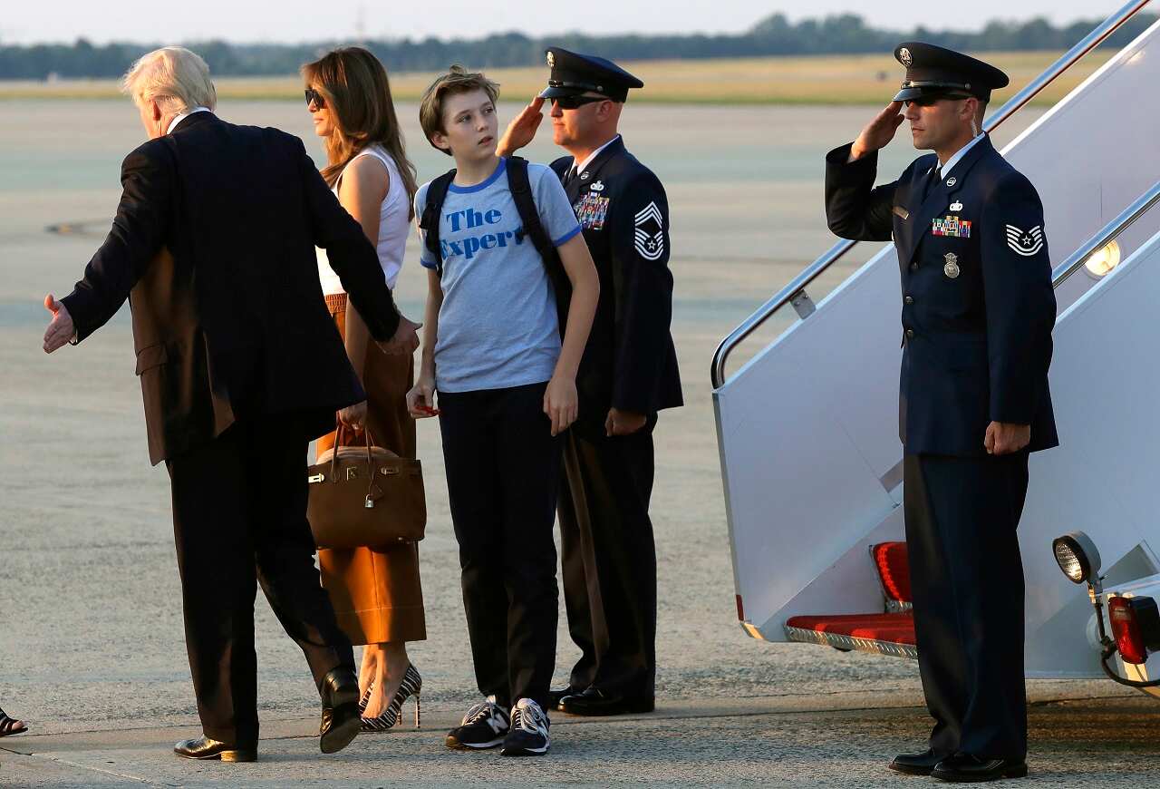 Barron Trump, son of President Donald Trump, looks back at Air Force One