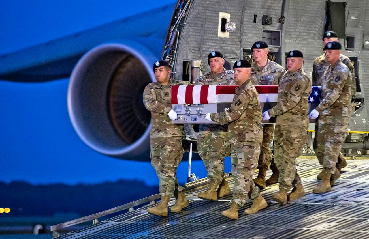The body of a US soldier killed in a suspected attack in Afghanistan returned to the US