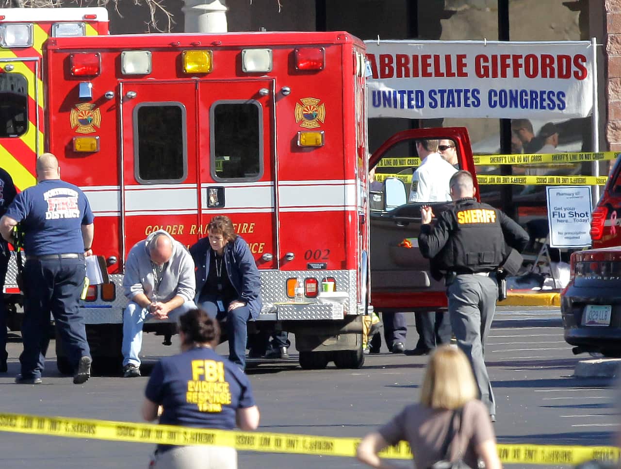 Emergency workers at the scene in Tuscon on January 8, 2011