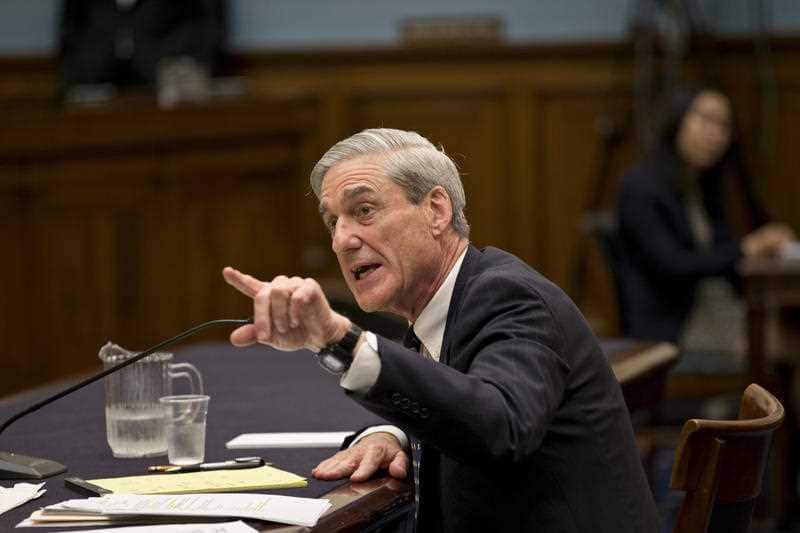 In this June 13, 2013 file photo, then-FBI Director Robert Mueller testifies on Capitol Hill in Washington.