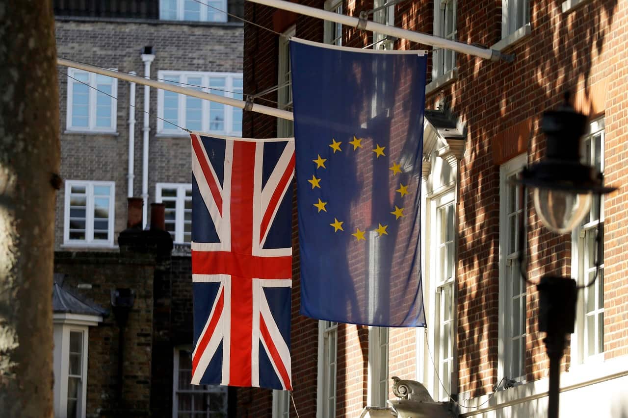 A European and British Union flags hang outside Europe House, London.