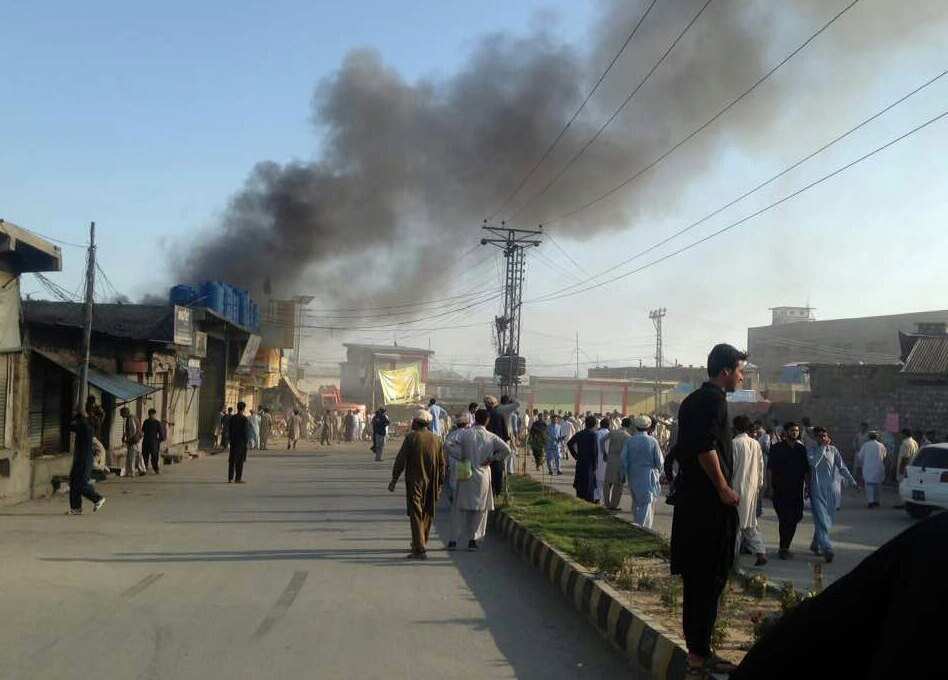 epa06045843 Smoke billows from the scene of a suicide bomb blast at Toori market in Parachinar, Pakistan, 23 June 2017. At least 15 people were killed and 30 others were injured in a suicide bomb blast in Parachinar on 23 June.  EPA/STR