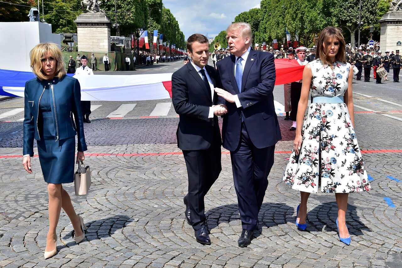 French President Emmanuel Macron shakes hands with US President Donald Trump after the Bastille Day military parade  in Paris 