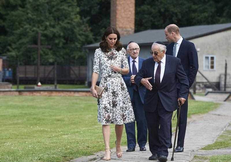Britain's Prince William, Duke of Cambridge (R) and Catherine, Duchess of Cambridge (L) meet with former prisoners of the camp Manfred Goldberg (2-R) and Zigi Shipper (2-L) during a visit to the Former Nazi-German Concentration Camp KL Stutthof.
