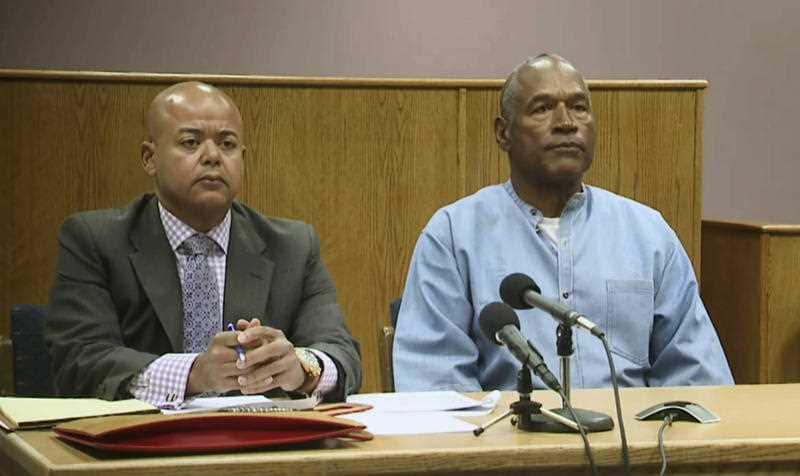 Former NFL football star O.J. Simpson appears with his attorney, Malcolm LaVergne