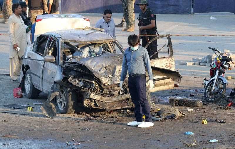 Pakistani security officials inspect the scene of an explosion in Lahore, Pakistan, 24 July 2017.