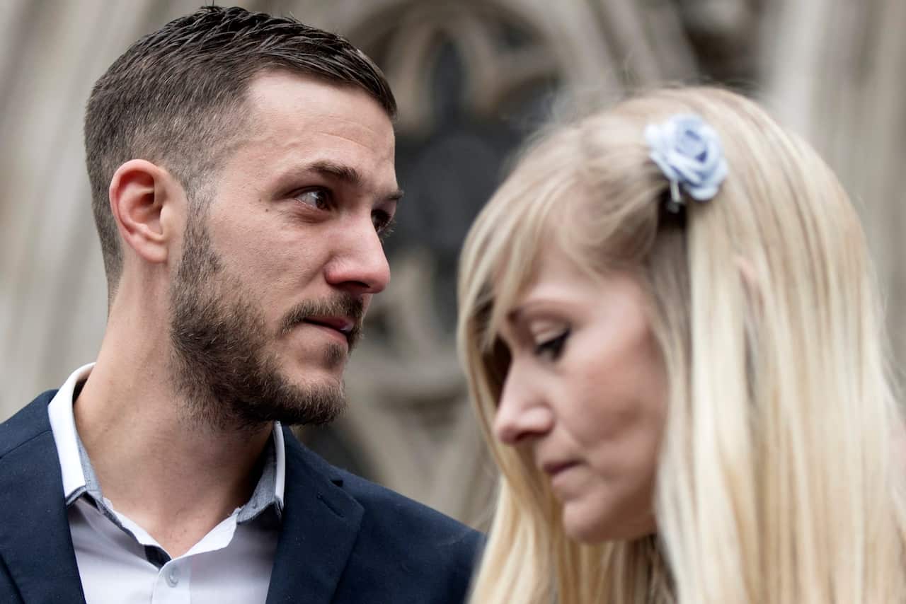 Parents of critically ill baby Charlie Gard, Chris Gard (L) Connie Yates (R) after delivering a statement outside the High Court