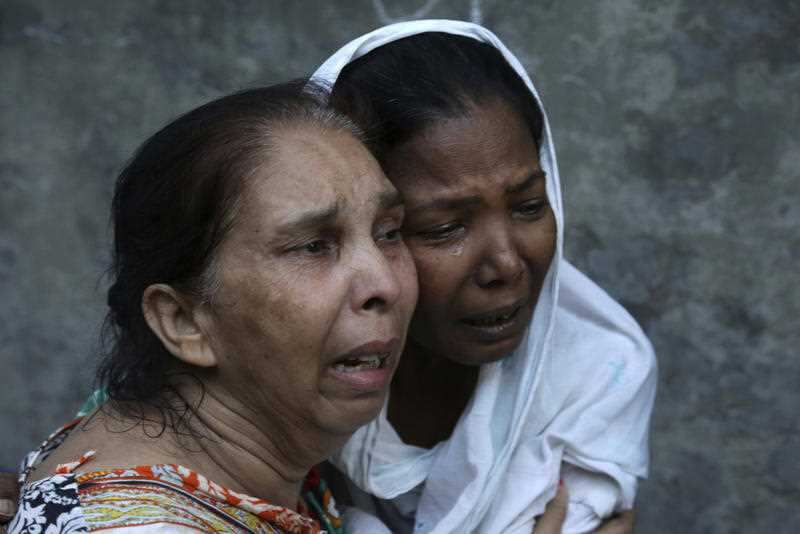 Relatives of the victims of a deadly bombing mourn in Lahore, Pakistan, Monday, July 24, 2017. 