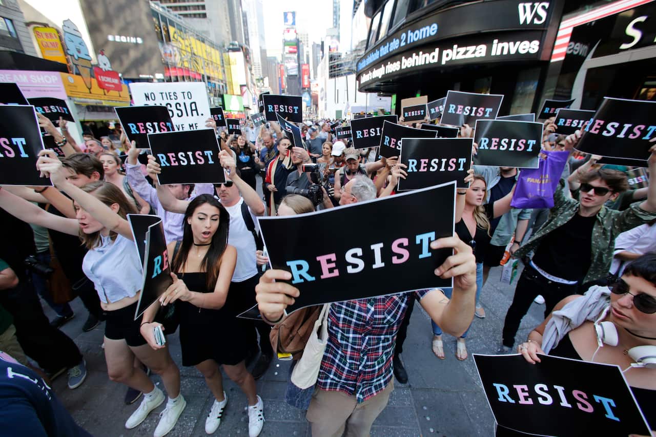 Protesters gathered in Times Square in 2017 to denounce Trump's announcement. 