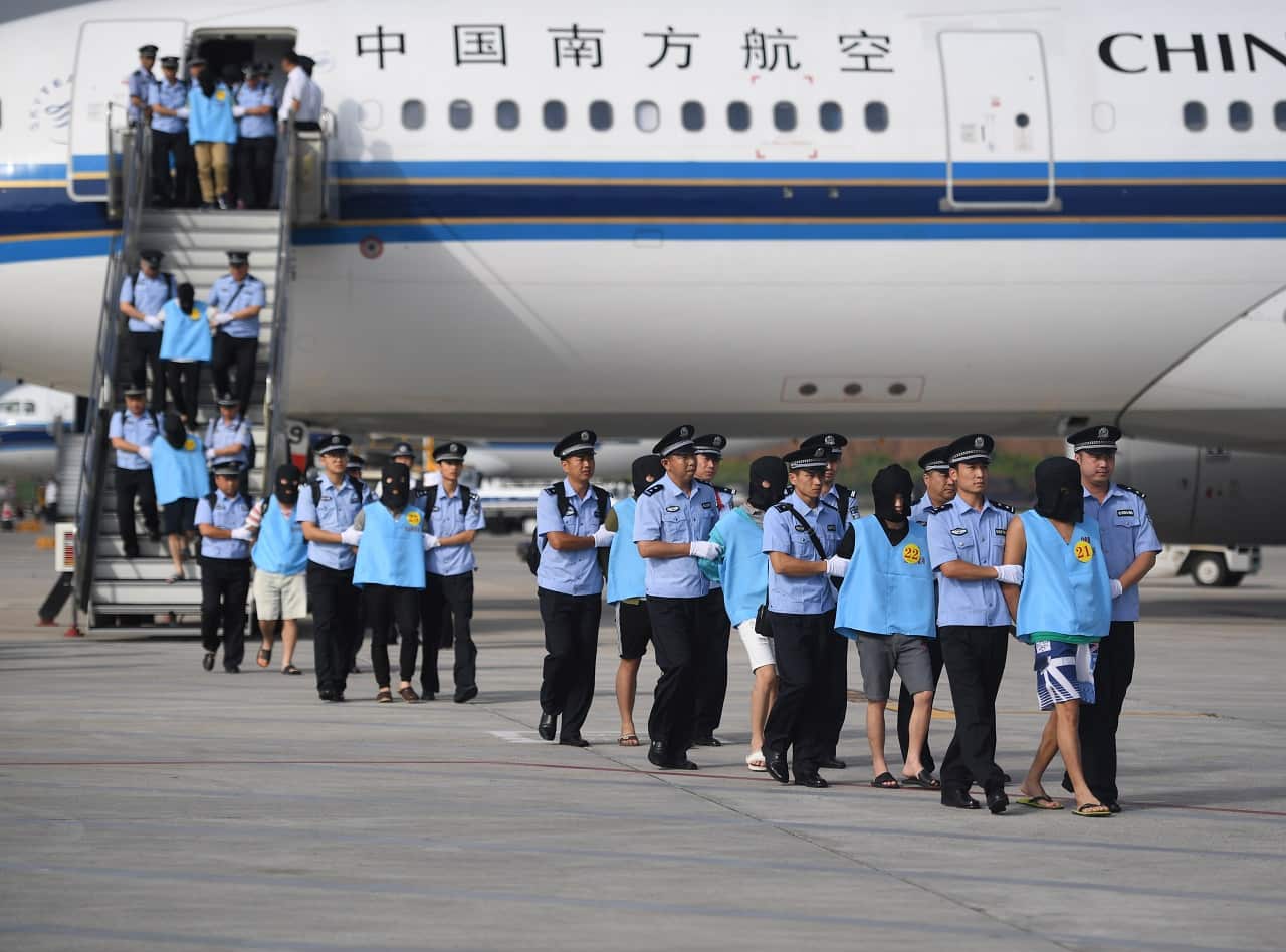 A total of 77 suspects in telecom and online fraud cases are brought back to China from Fiji.