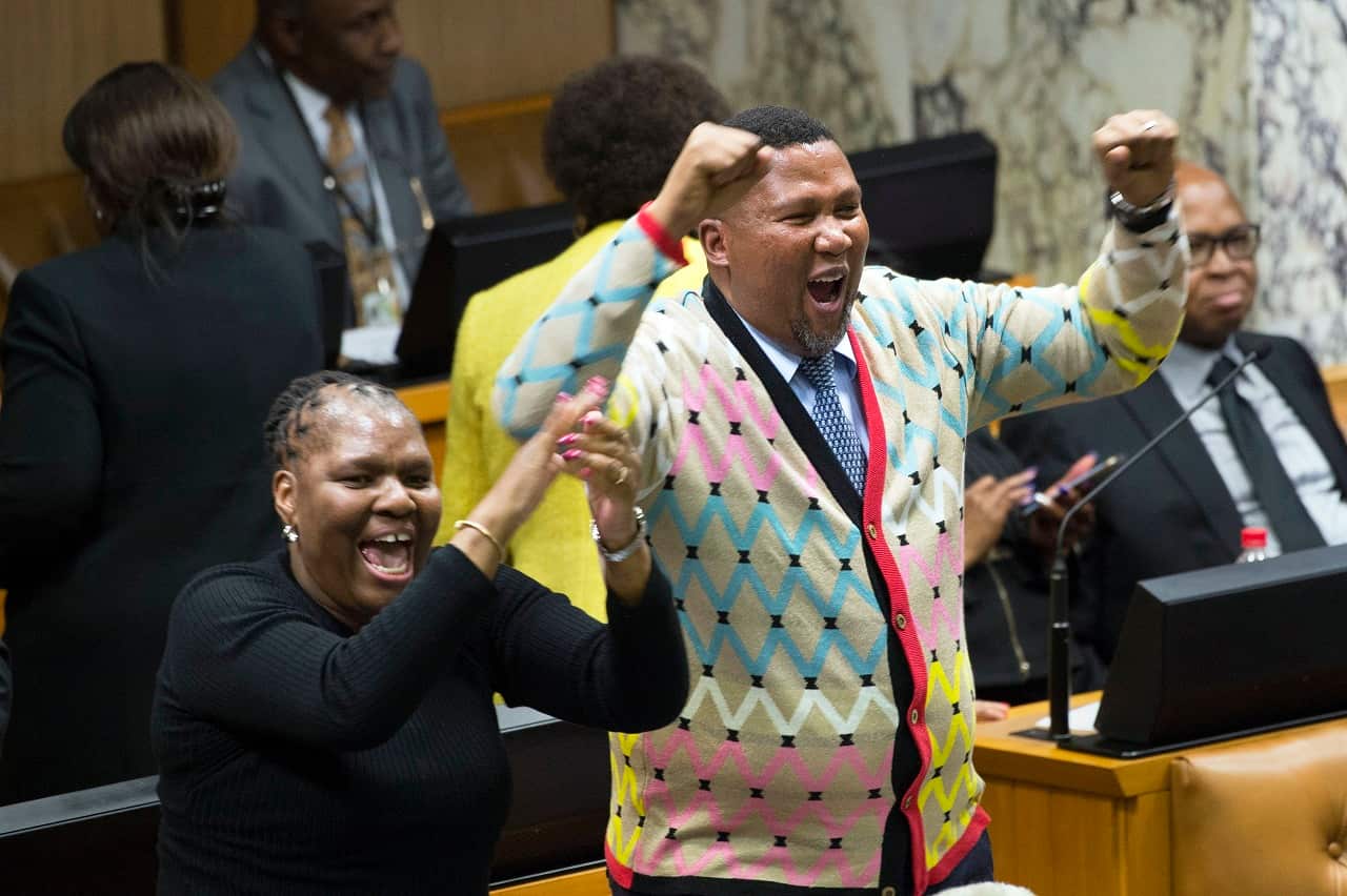 Mandla Mandela, Nelson Mandela's grandson cheers after a no confidence debate and vote against South African president, Jacob Zuma.