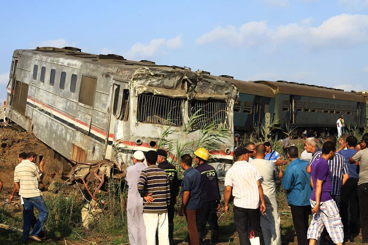 People view the wreckage after two passenger trains collided in Alexandria, Egypt, 11 August 2017.