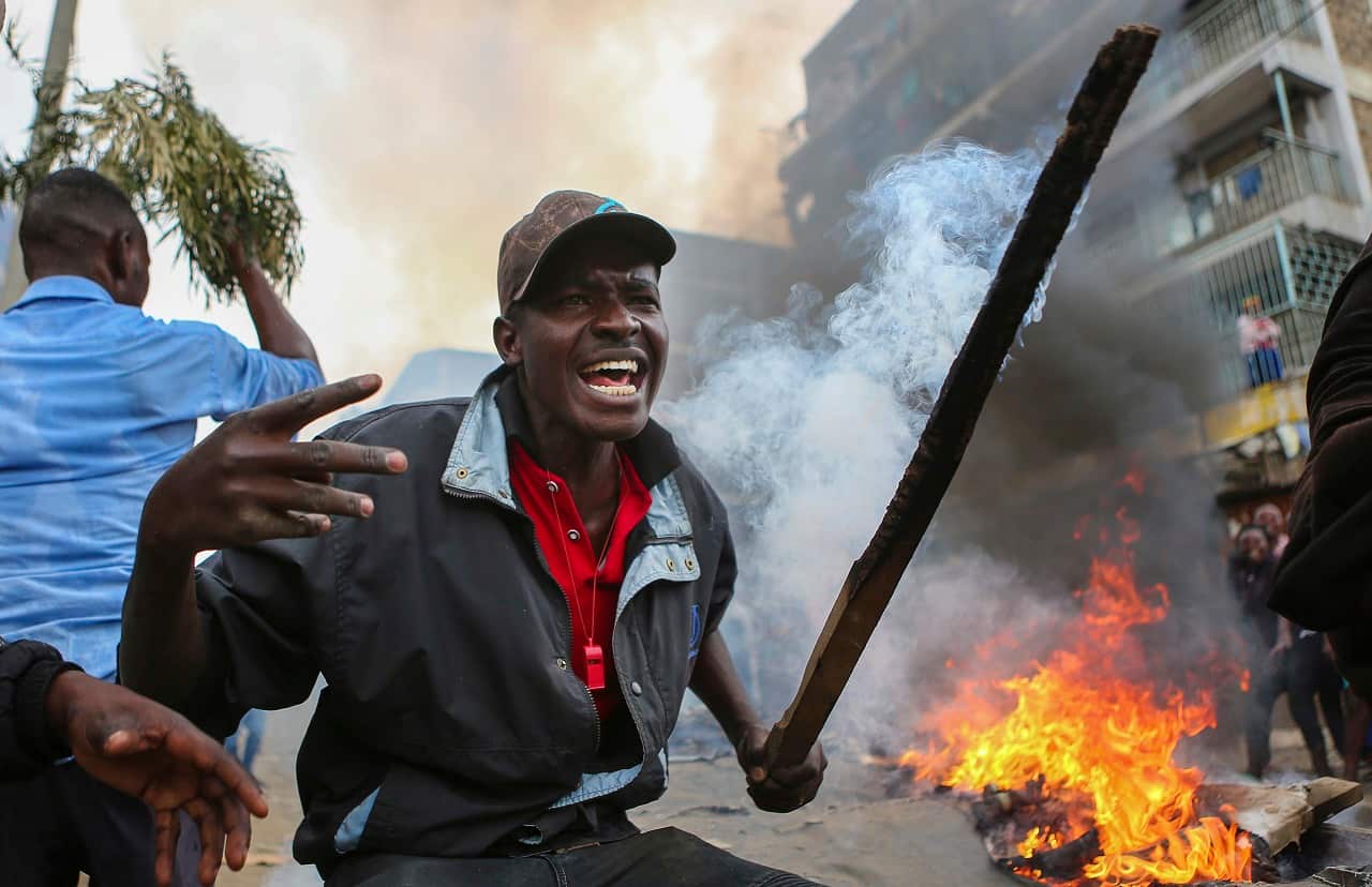 Residents of the Mathare area of Nairobi, Kenya, take to the streets to protest in support of Kenyan opposition leader and presidential candidate Raila Odinga.