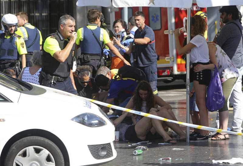 Injured people are treated in Barcelona, Spain, Thursday, Aug. 17, 2017
