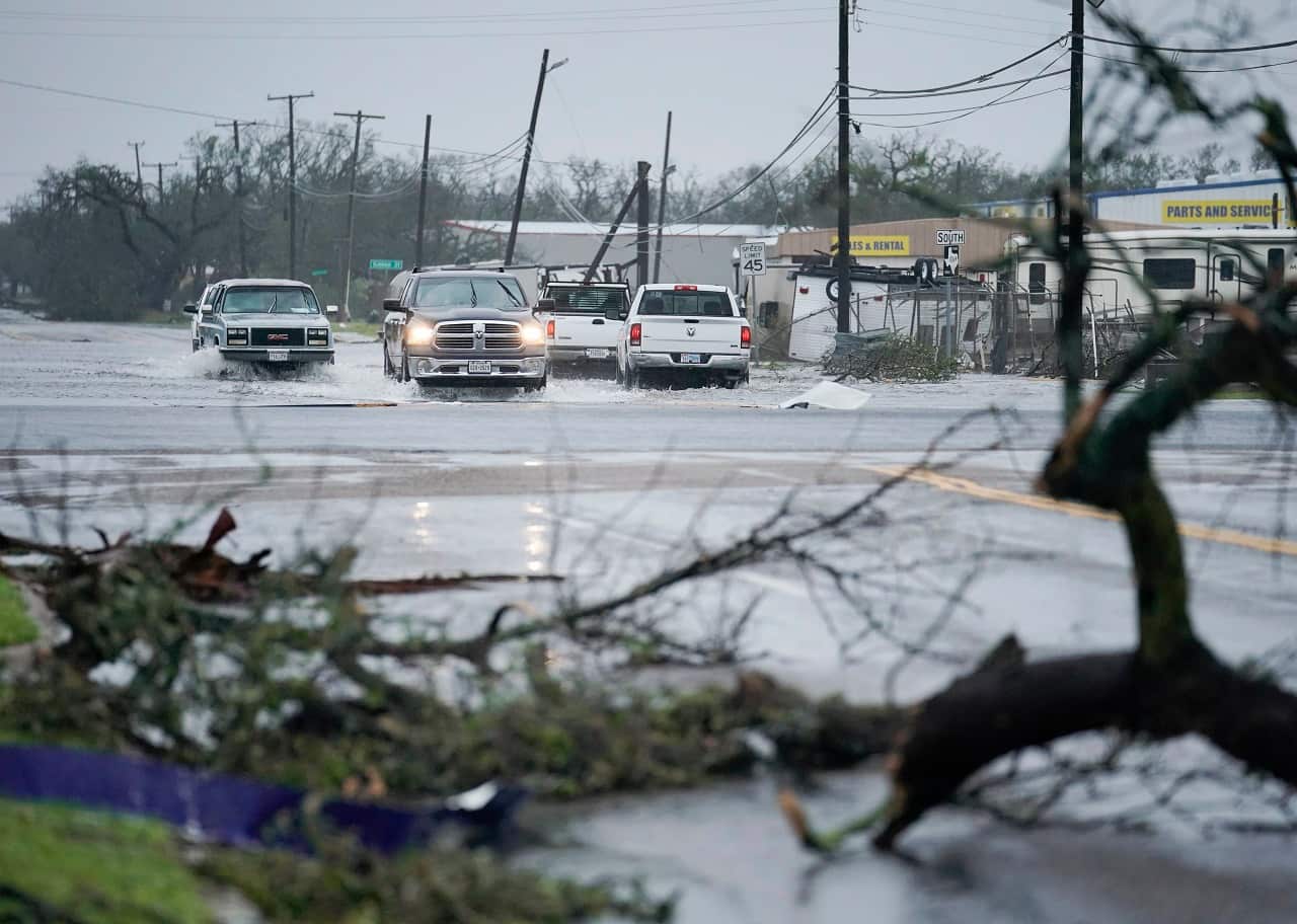 Motorists drive through flood waters in the aftermath of Hurricane Harvey in Rockport, Texas, USA, 26 August 2017.