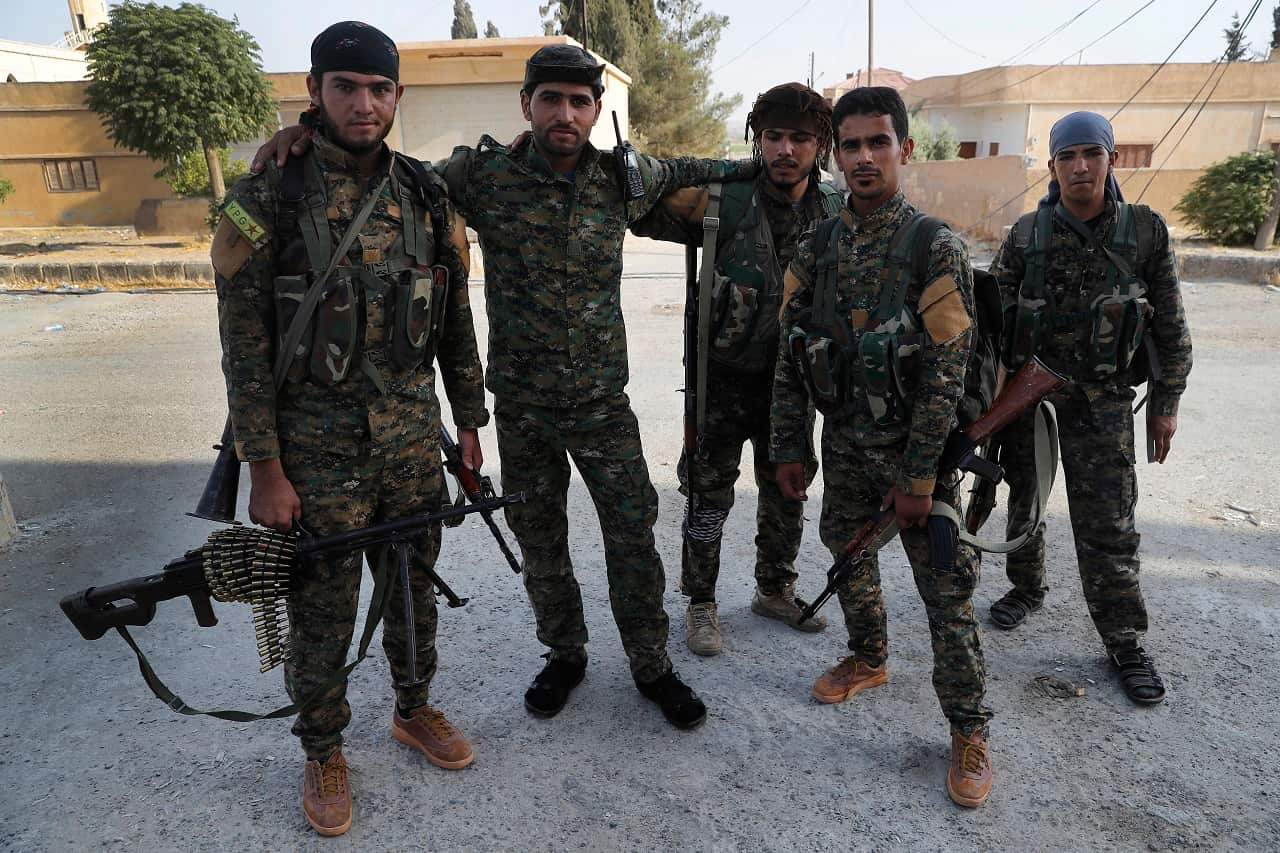 Arab and Kurdish fighters with the US-backed Syrian Democratic Forces (SDF), as they prepare to move to the front line to battle against IS in Raqqa,