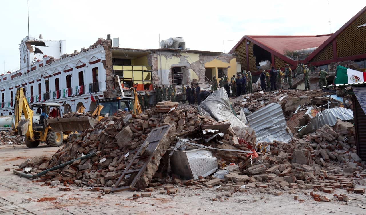 Soldiers remove debris from a partly collapsed municipal building after the earthquake in Juchitan, Mexico.