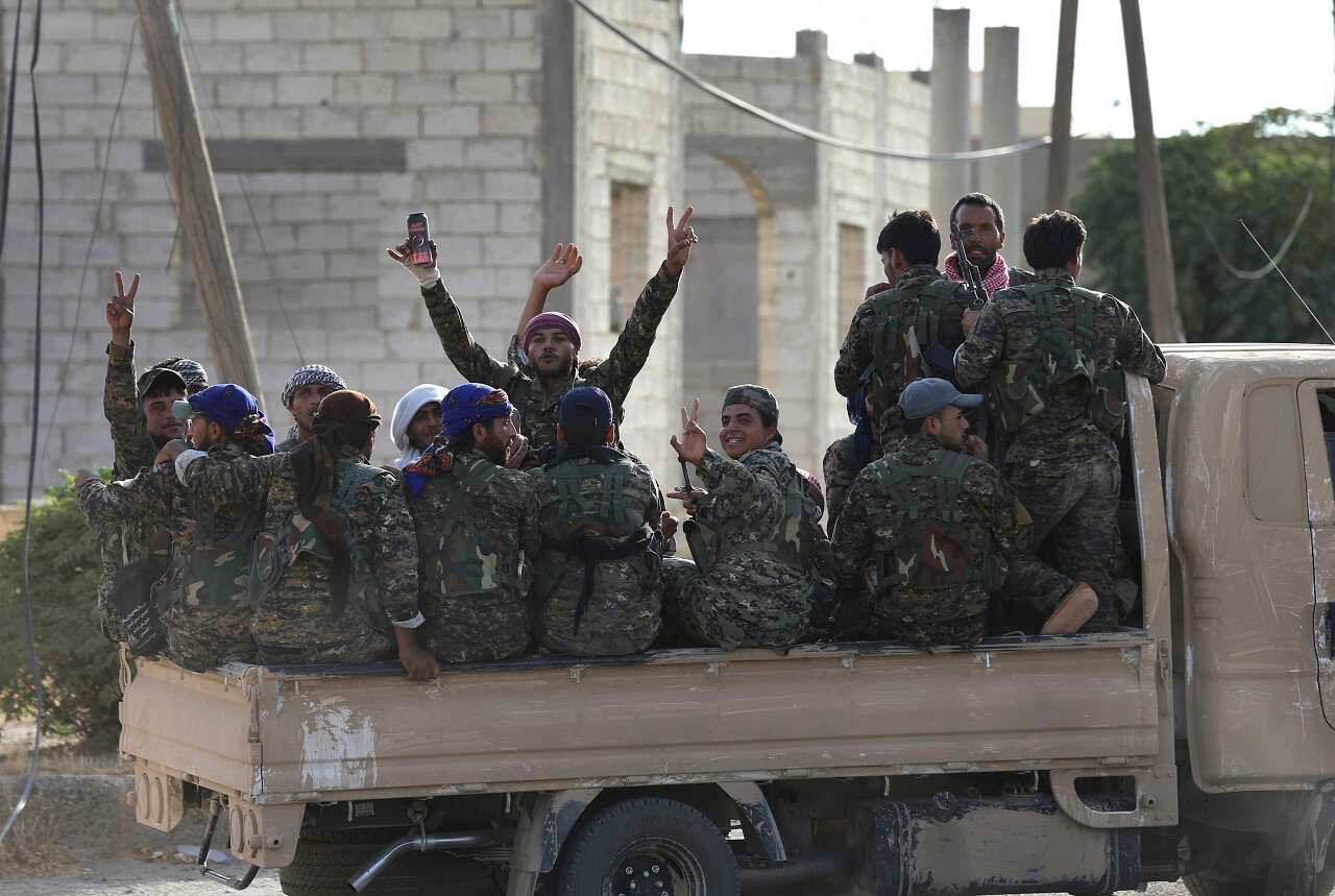 Arab and Kurdish fighters with US-backed Syrian Democratic Forces (SDF), move to the front line in Raqqa, northeast Syria.