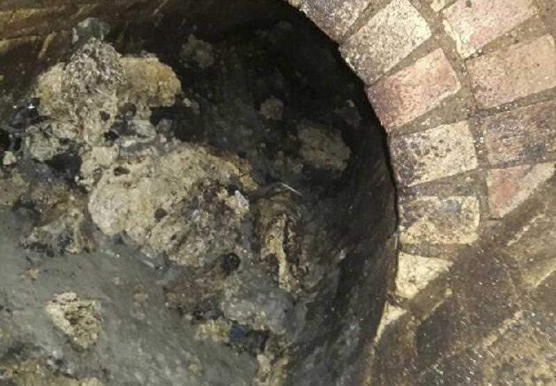 In this undated handout photo issued by Thames Water on Tuesday, Sept. 12, 2017, a view of part of a fatberg inside a sewer in Whitechapel, London.