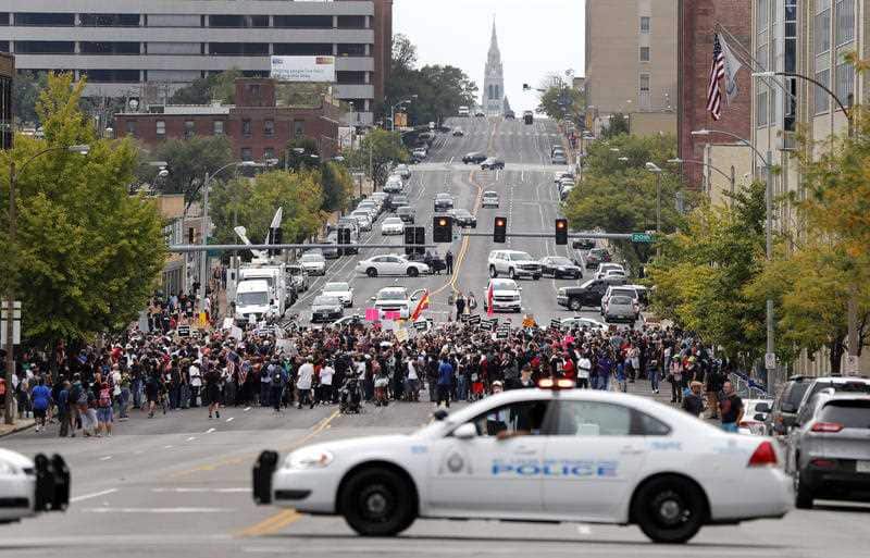 Demonstrators protest outside the St. Louis Police Department headquarters in response to a not guilty verdict in the trial of former St. Louis police officer Jason Stockley Sunday, Sept. 17, 2017.